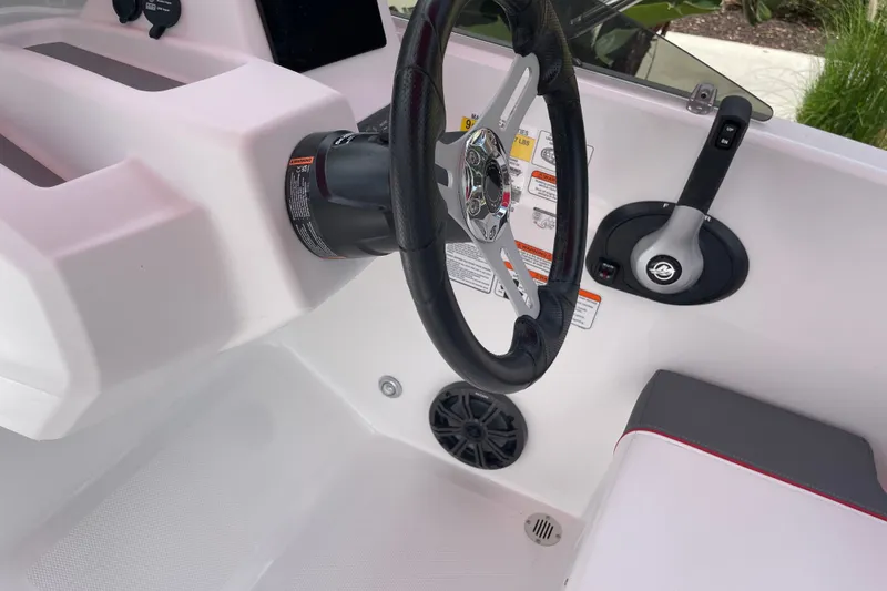Slide: The Image of 2027 Tahoe T18 boat cockpit with steering wheel and control panel. - 9