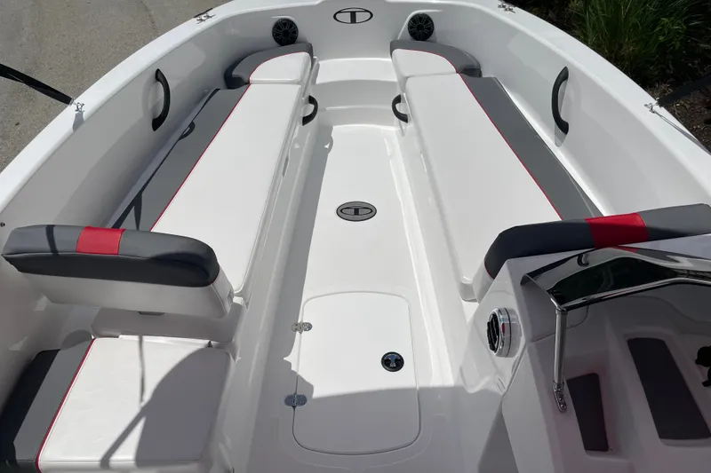 Slide: The Image of 2027 Tahoe T18 boat interior with white and gray seating, red accents, and modern design. - 8