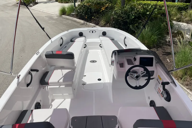 Slide: The Image of 2027 Tahoe T18 boat interior with modern seating and steering console. - 7