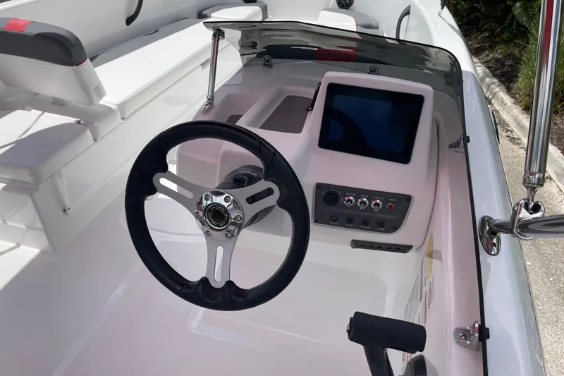 Slide: The Image of 2027 Tahoe T18 boat cockpit with steering wheel and control panel. - 5
