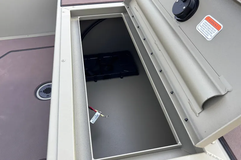 Slide: The Image of Open storage compartment in 2027 Tracker Grizzly 1860 CC boat. - 18