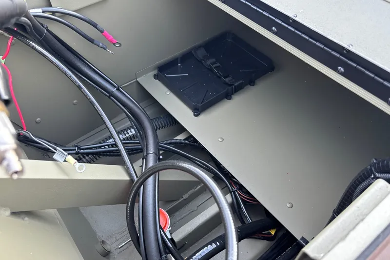 Slide: The Image of Interior wiring and components of a 2027 Tracker Grizzly 1860 CC boat. - 20