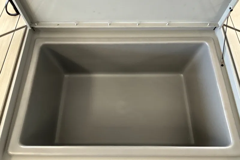Slide: The Image of Open storage compartment in 2027 Tracker Bass Tracker Classic CC boat. - 26