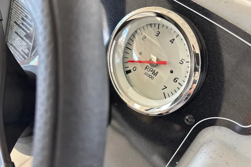 Slide: The Image of Close-up of RPM gauge on 2027 Tracker Bass Tracker Classic CC boat dashboard. - 18