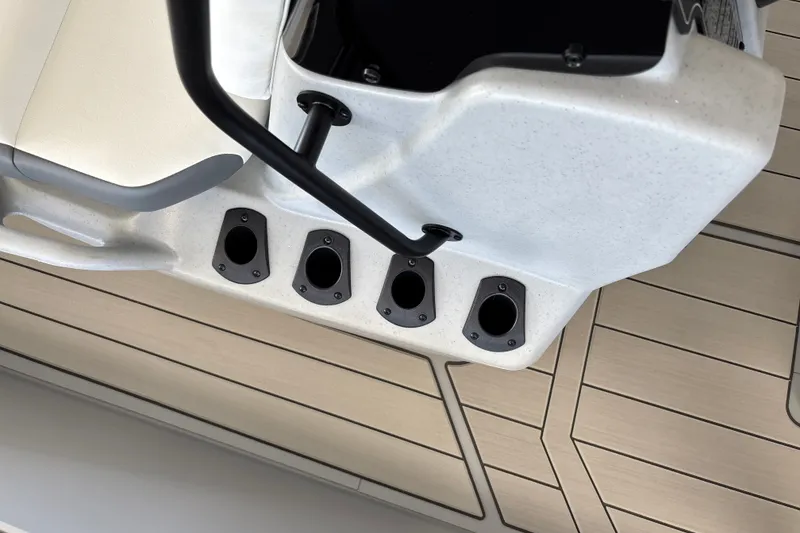 Slide: The Image of 2027 Tracker Bass Tracker Classic CC boat interior with rod holders and seating. - 21