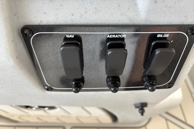 Slide: The Image of Control panel with switches for navigation, aerator, and bilge on 2027 Tracker Bass Tracker Classic CC. - 19