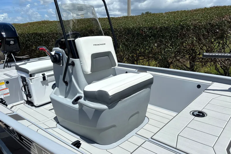 Slide: The Image of 2027 Tracker Bass Tracker Classic CC boat interior with steering console and seating. - 15