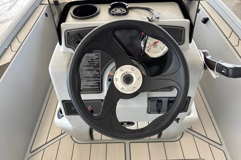 Slide: The Image of Steering console of 2027 Tracker Bass Tracker Classic CC boat with RPM gauge. - 17