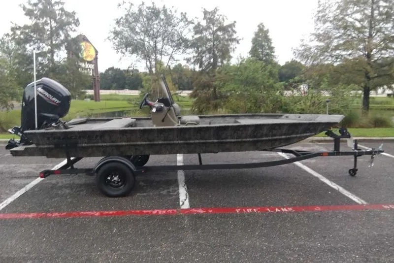 The Image of 2027 Tracker Grizzly 1860 CC boat on trailer in parking lot. - 0