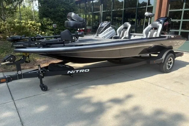 The Image of 2027 Nitro Z18 XL Pro fishing boat on trailer, parked outdoors. - 0