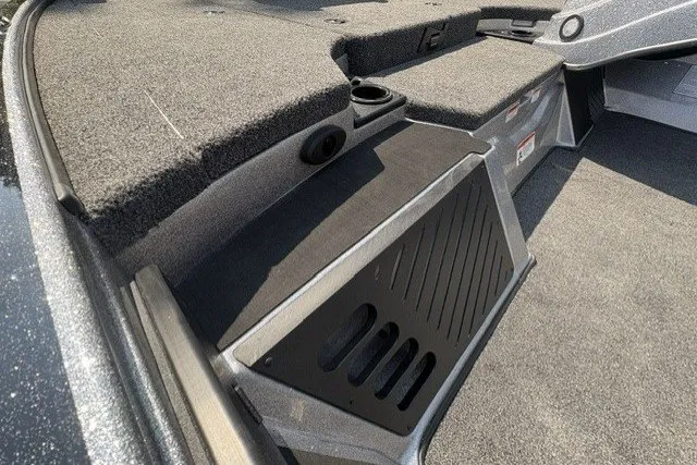 Slide: The Image of Interior view of 2027 Nitro Z18 XL Pro boat, featuring carpeted deck and storage compartments. - 6