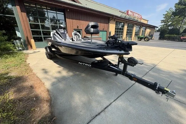 Slide: The Image of 2027 Nitro Z18 XL Pro boat on trailer outside a boat service center. - 7