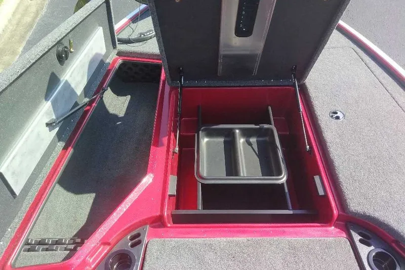 Slide: The Image of Open storage compartment in a 2027 Nitro Z18 XL boat, featuring a red interior. - 8