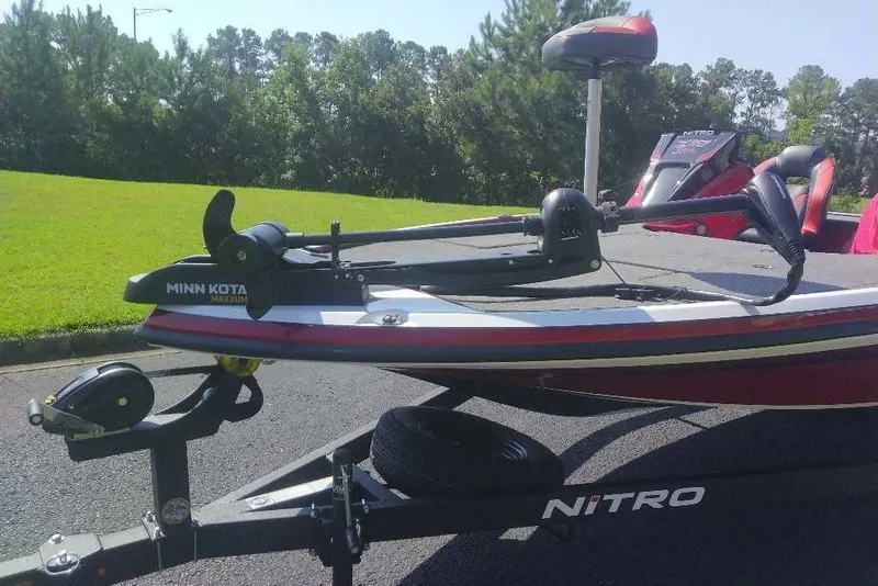 Slide: The Image of 2027 Nitro Z18 XL boat with Minn Kota Maxxum trolling motor on trailer. - 2