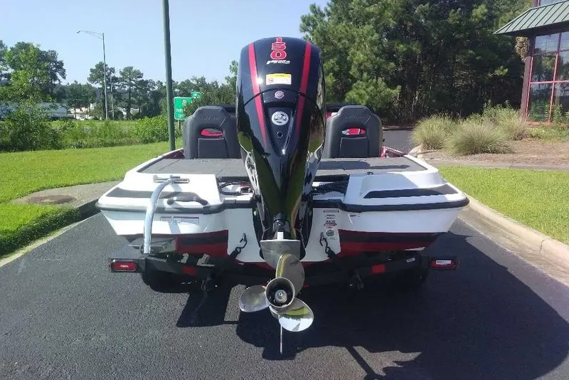 Slide: The Image of 2027 Nitro Z18 XL boat with powerful outboard motor, parked on a sunny day. - 9