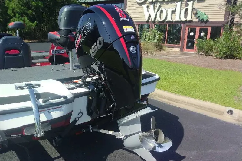 Slide: The Image of Nitro Z18 XL 2027 boat with powerful outboard motor at dealership. - 10
