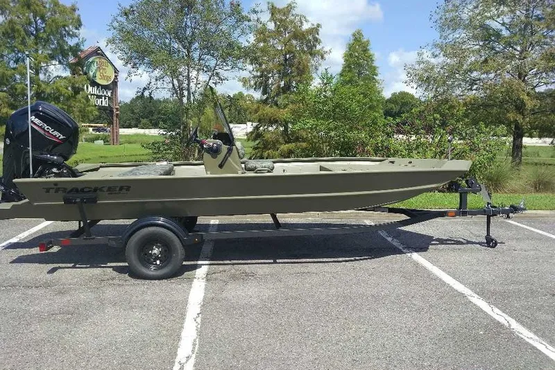 The Image of 2027 Tracker Grizzly 1860 CC boat on trailer in parking lot. - 0