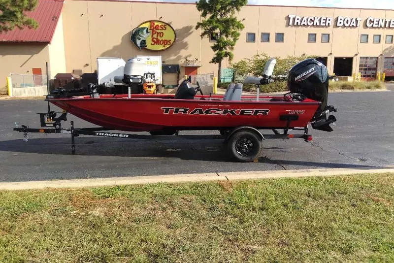 The Image of 2027 Tracker Pro Team 175 boat on trailer outside Bass Pro Shops. - 0