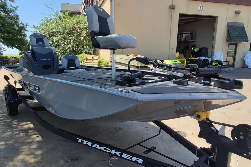 The Image of 2027 Tracker Pro 170 boat on trailer, parked outside a building. - 0