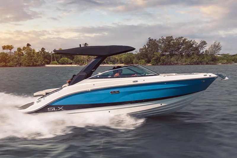 The Image of Manufacturer Provided Image: 2025 Sea Ray SLX 260 boat cruising on water, featuring sleek design and vibrant blue hull. - 0