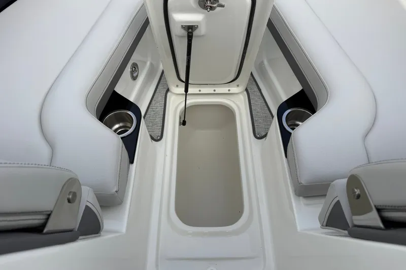 Slide: The Image of Interior view of 2027 Sea Ray SLX 260 boat with storage compartment and cup holders. - 19