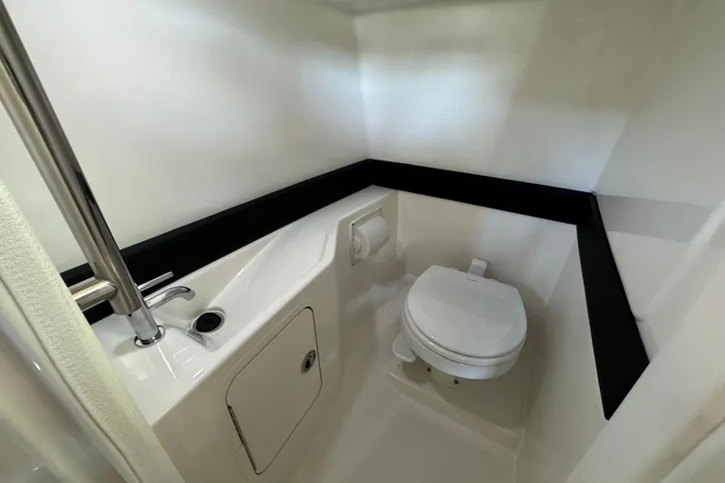 Slide: The Image of 2027 Sea Ray SLX 280 boat bathroom with modern fixtures and compact design. - 17