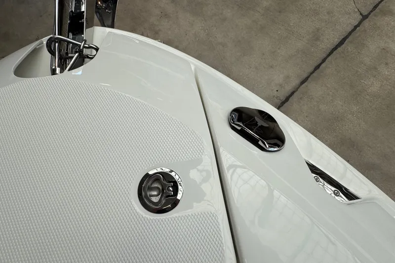 Slide: The Image of 2027 Sea Ray SLX 280 boat deck with chrome details and textured surface. - 21