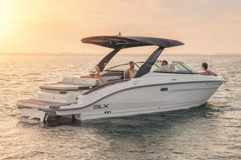 Slide: The Image of Manufacturer Provided Image: 2025 Sea Ray SLX 280 boat cruising on serene waters at sunset. - 1