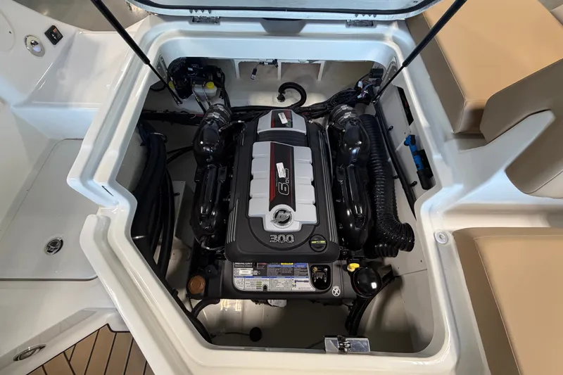 Slide: The Image of Engine compartment of 2027 Sea Ray SDX 230 boat, showcasing powerful motor and clean design. - 16