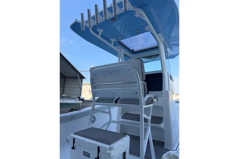 Slide: The Image of 2027 Blackfin 242 HB boat interior with seating and Yeti cooler. - 16