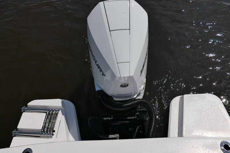 Slide: The Image of 2027 Blackfin 242 HB boat with Mercury Verado outboard engine on water. - 41