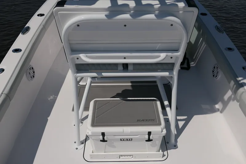Slide: The Image of 2027 Blackfin 242 HB boat interior with Yeti cooler and seating arrangement. - 37