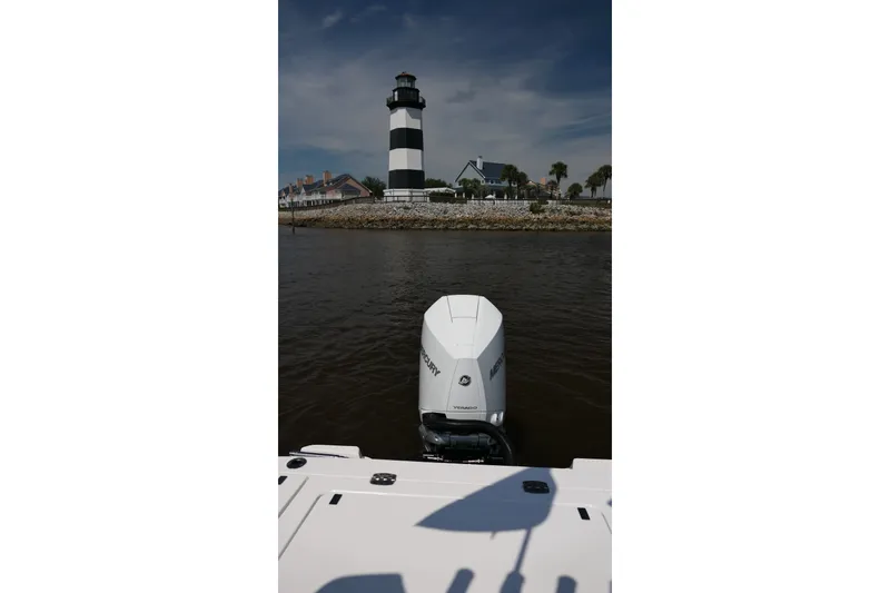Slide: The Image of Blackfin 242 HB boat with Mercury engine near a lighthouse, 2027 model. - 47