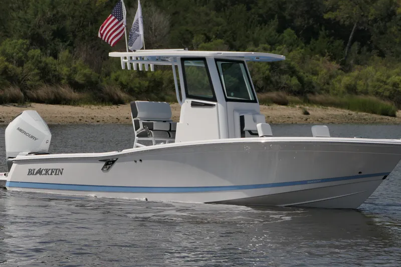 The Image of 2027 Blackfin 242 HB boat on water, featuring sleek design and Mercury engine. - 0