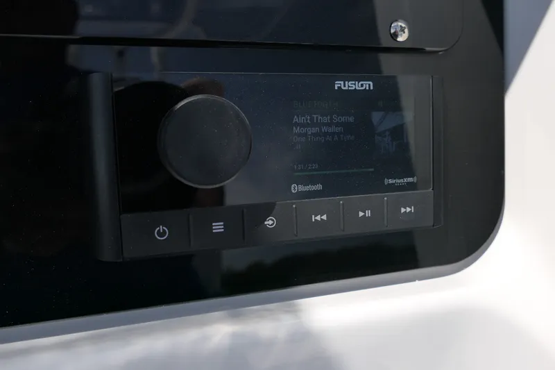 Slide: The Image of Fusion stereo system on Blackfin 242 HB boat, displaying music track details. - 34