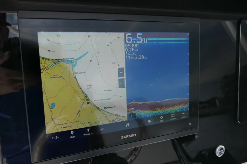 Slide: The Image of Garmin marine display on Blackfin 242 HB, showing navigation and sonar data. - 32