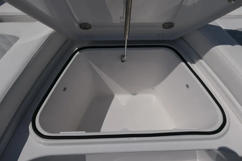 Slide: The Image of Open storage compartment on 2027 Blackfin 242 HB boat, showcasing interior space. - 43