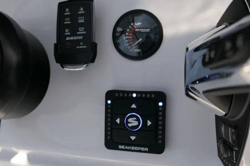 Slide: The Image of Control panel of 2027 Blackfin 242 HB boat featuring Seakeeper and SeaStar systems. - 33
