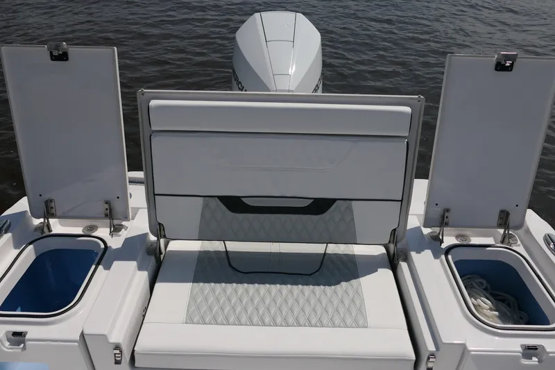 Slide: The Image of 2027 Blackfin 242 HB boat stern with storage compartments and seating. - 19