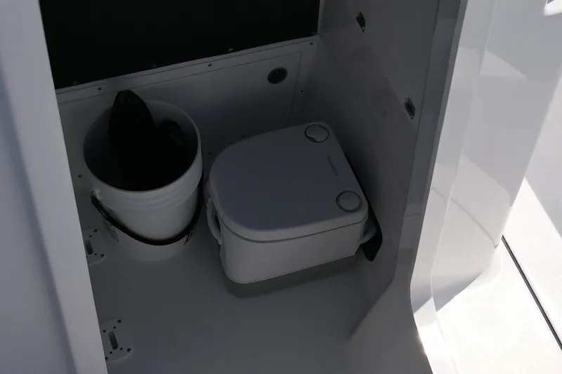 Slide: The Image of Storage compartment in a 2027 Blackfin 242 HB boat, featuring organized interior space. - 22