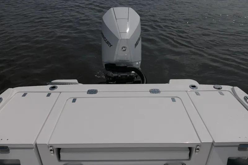 Slide: The Image of 2027 Blackfin 242 HB boat with Mercury outboard engine on water. - 20