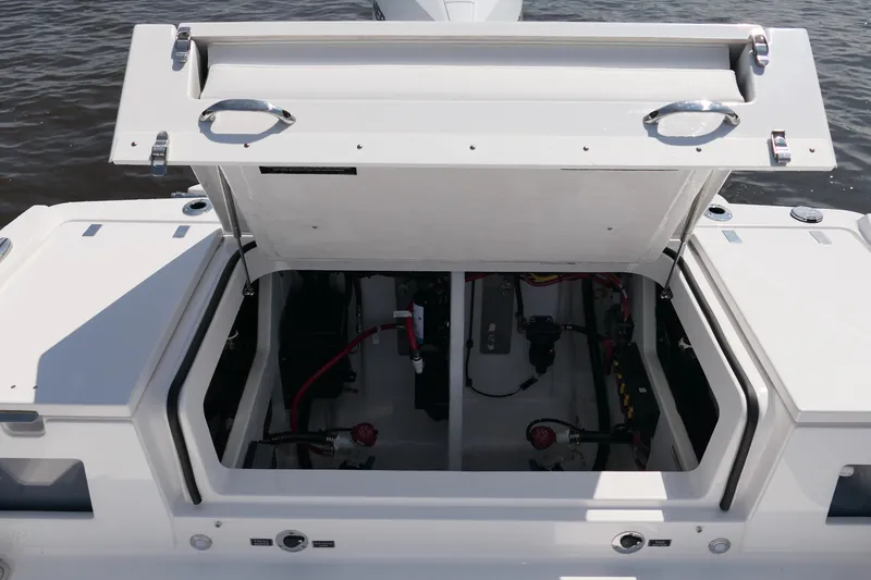 Slide: The Image of Open hatch of 2027 Blackfin 242 HB boat showing internal compartments. - 39