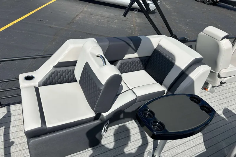 Slide: The Image of Luxurious seating on 2026 Sylvan L3 LZ Tritoon boat with cup holders and sleek design. - 4