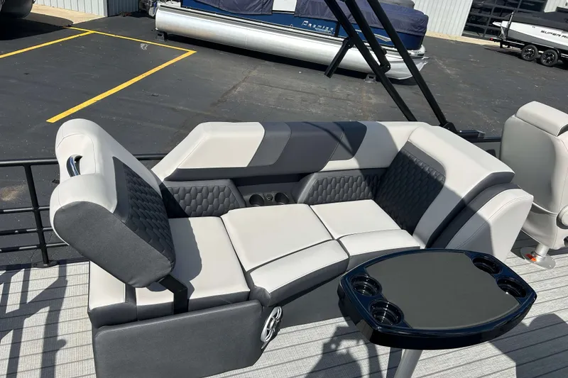 Slide: The Image of Luxurious seating on 2026 Sylvan L3 LZ Tritoon boat with sleek design and cup holders. - 3