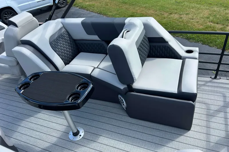 Slide: The Image of Luxurious seating on 2026 Sylvan L3 LZ Tritoon with table and cup holders. - 7