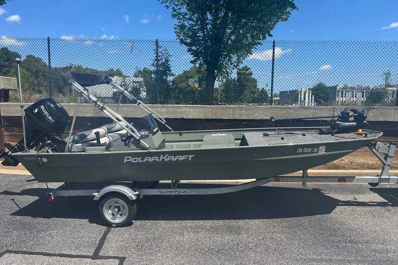 The Image of 2022 Polar Kraft Sportsman 1654 SE boat on trailer, parked outdoors. - 0