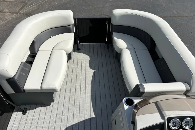 Slide: The Image of 2026 Sylvan Mirage 820 Cruise boat interior with plush seating and modern design. - 10