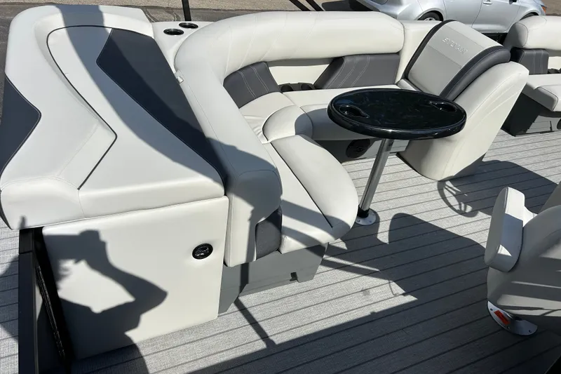 Slide: The Image of Luxurious seating on 2026 Sylvan Mirage 820 Cruise pontoon boat with sleek design and table. - 5