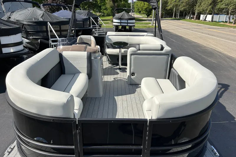 Slide: The Image of 2026 Sylvan Mirage 820 Cruise pontoon boat with spacious seating and sleek design. - 1