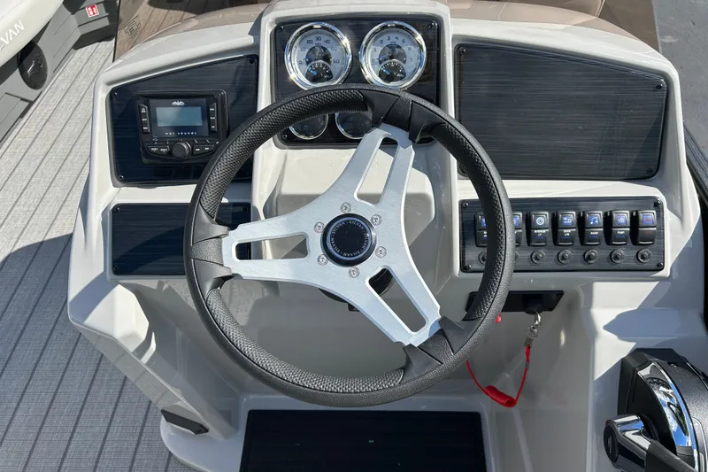 Slide: The Image of Steering console of 2026 Sylvan Mirage 820 Cruise boat with modern controls. - 8